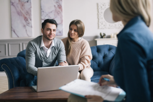 Couple seated together during a planning discussion with a professional.