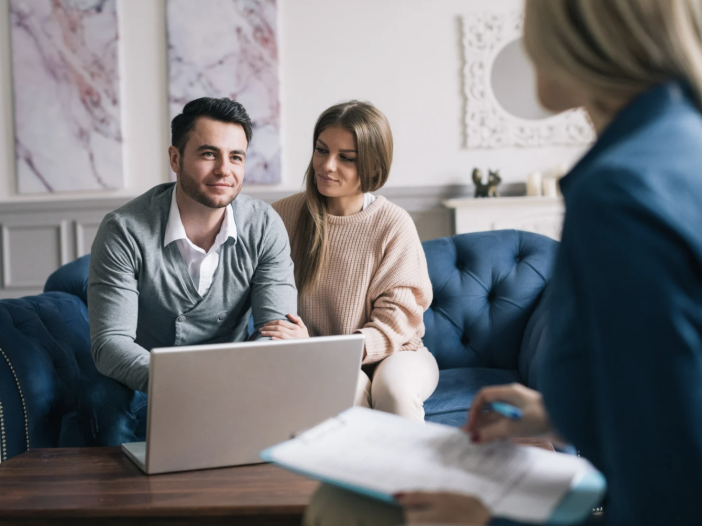 Couple seated together during a planning discussion with a professional.