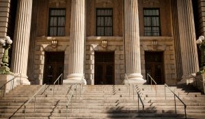 Exterior of a courthouse building with columns and stone steps