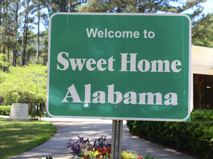 Sign reading "Welcome to Sweet Home Alabama"