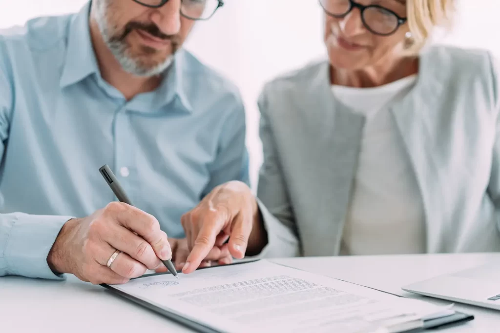 Estate Planning Services photo of couple signing legal will