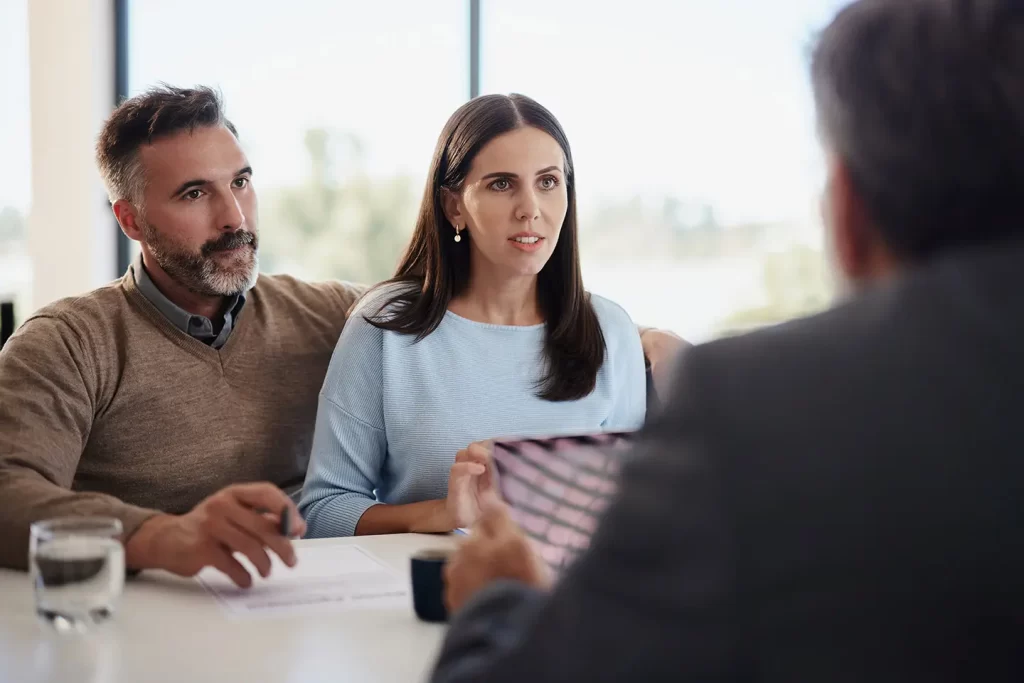 Couple with frequently asked questions for their estate planning lawyer