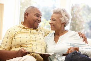 An older couple sitting together at home — for many Alabama families, a second marriage brings new estate planning questions about protecting both a spouse and children from a previous relationship.