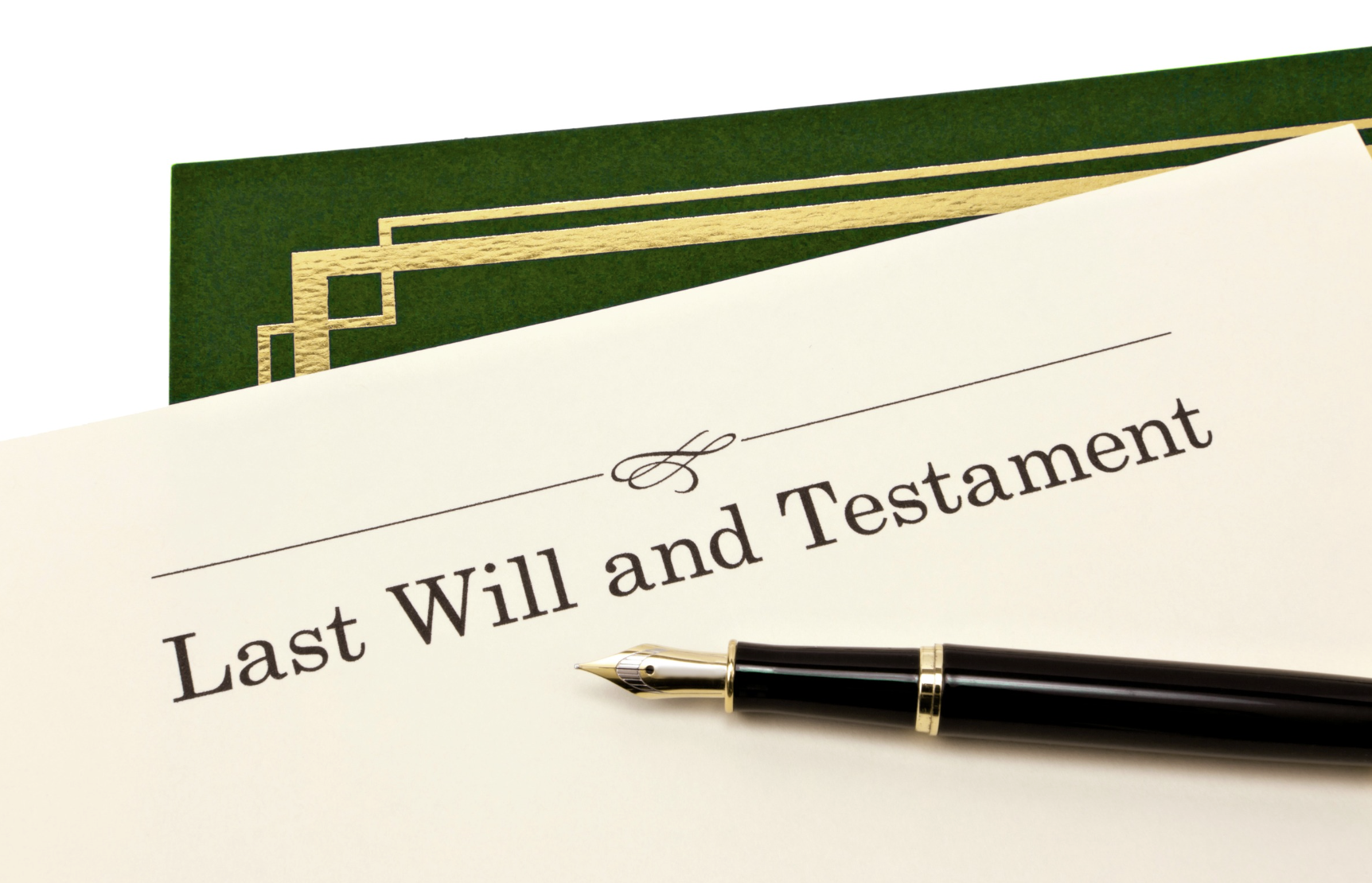 Last Will and Testament document with a fountain pen resting on top, next to a green folder with gold trim
