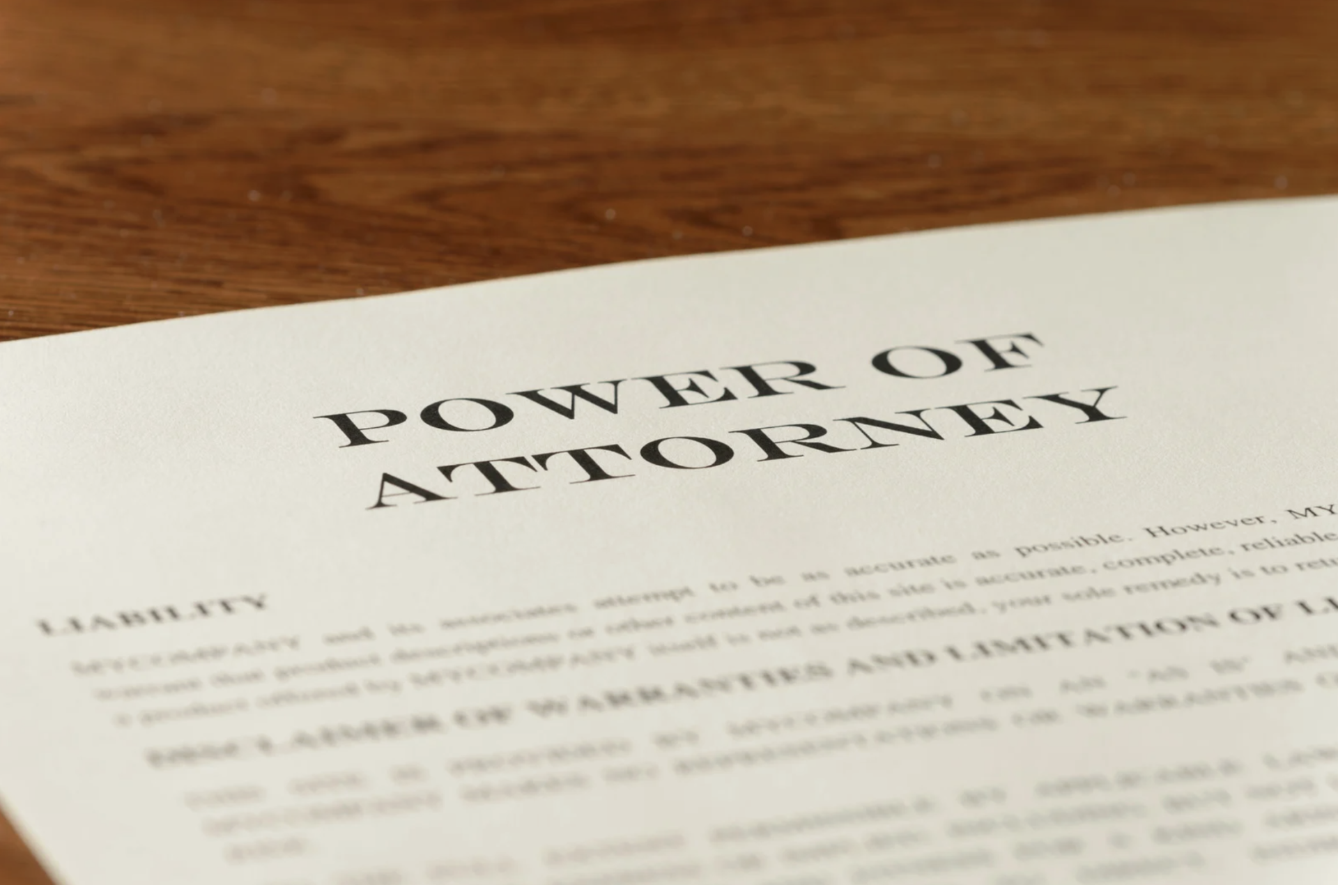 Spower of attorney document sitting on a desk, There are several types of power of attorney, each covering a different kind of authority.